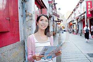 Woman looking for location in Macau city photo