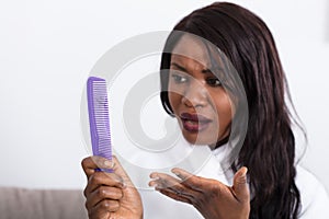 Woman Looking At Loss Hair