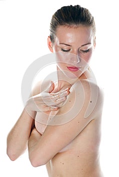 Woman looking mall on her skin