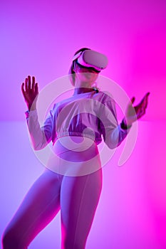 Woman looking metaverse wearing virtual reality headset