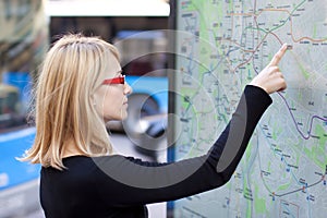 Woman looking on the metro map board