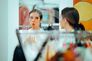 Woman Looking in the Mirror Checking Outfit Fixing Jacket