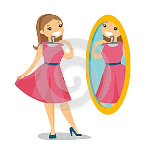 Woman looking in the mirror in the dressing room.