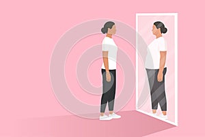 Woman looking at the mirror and seeing herself as overweight