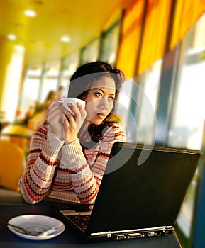 A woman looking out onto the airport runaway