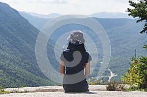 Woman looking out over crawford notch mountain landscape photo