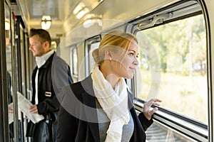 Woman looking out the train window traveling
