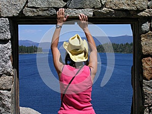 Woman looking out window at Tea House on Fannette Island