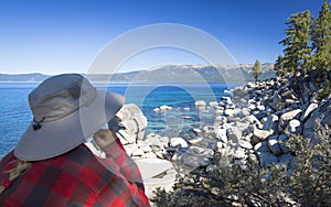 Woman Looking Over Beautiful Shoreline of Lake Tahoe.