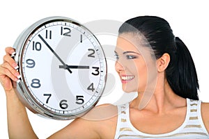 Woman Looking Over Clock