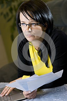 Woman looking over paperwork