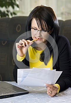 Woman looking over paperwork