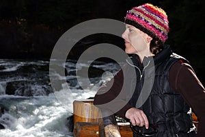 Woman looking over river falls