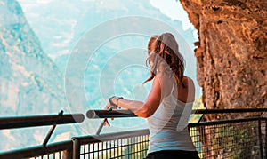 Woman looking at panoramic alps mountain