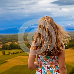 Woman looking at panoramic view of France countrysid
