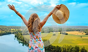 Woman looking at panoramic view of France countrysid
