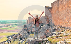 Woman looking at panoramic view of Gormaz castle, Soria province