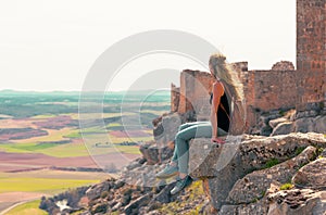 Woman looking at panoramic view of Gormaz castle, Soria province