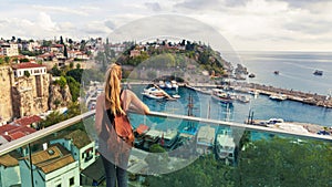 Woman looking at panoramic view of harbor in Antalya