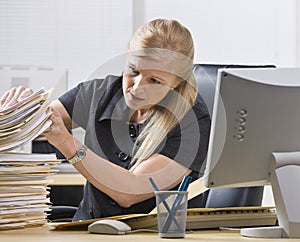 Woman Looking Through Paperwork