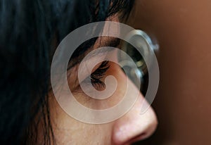 Woman looking through peephole