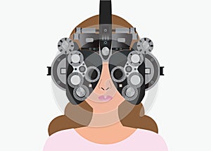 Woman looking through phoropter during eye exam.