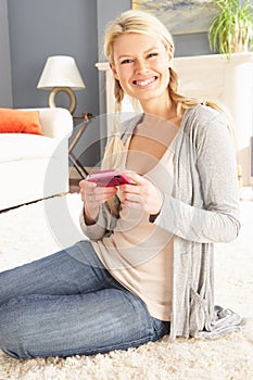 Woman Looking At Photograph On Digital Camera