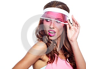 Woman looking through the pink sun visor at camera