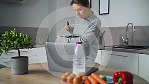 Woman looking recipe online while cooking