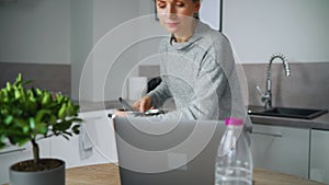 Woman looking recipe online while cooking