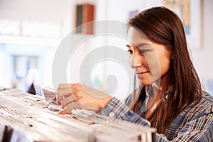 Woman looking through records at a record shop