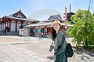 Woman looking relaxing while visiting temple