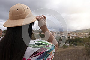 Woman looking at scenic view village photo