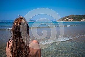 Woman looking into the sea.