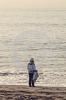 Woman looking at the Sea in the Beach