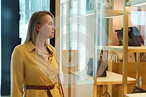 Woman looking at the shop window
