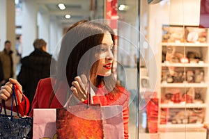 Woman looking at the shop window