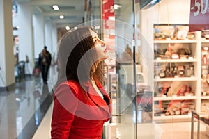 Woman looking at the shop window