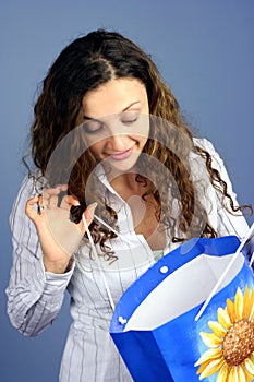 Woman looking into shopping bag