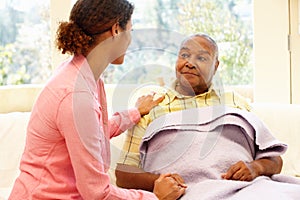 Woman looking after sick father photo