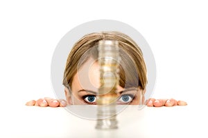 Woman looking at stack of coins