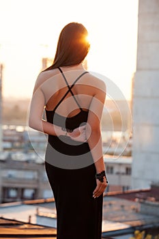 Woman looking at sunset