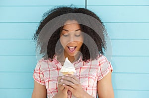 Woman looking surprised with ice cream