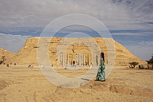 Woman looking at the Temple of Nefertari