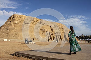 Woman looking at the Temple of Nefertari