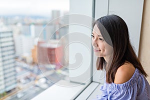 Woman looking though the city photo