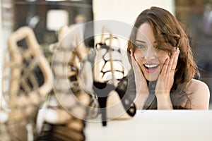 Woman looking to showcase or shop window