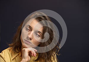 Woman looking to the side thinking