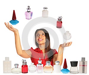 Woman looking up and juggling perfumes