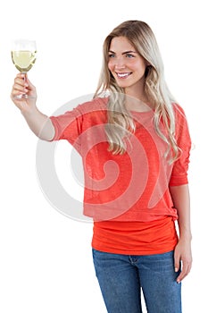 Woman looking at white wine glass